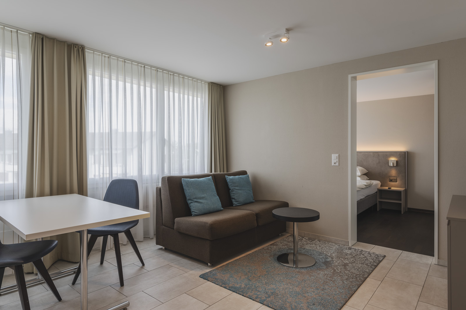 Spacious modern living room in Amanthos Living serviced apartment